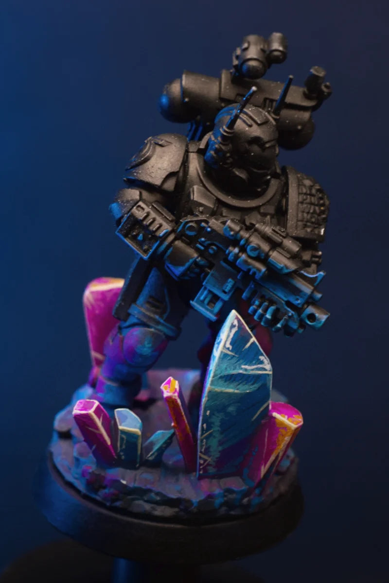 An underworld of towering crystals, sharp formations, and prismatic light. A striking sci-fi base designed to make both dark and vibrant miniatures stand out.